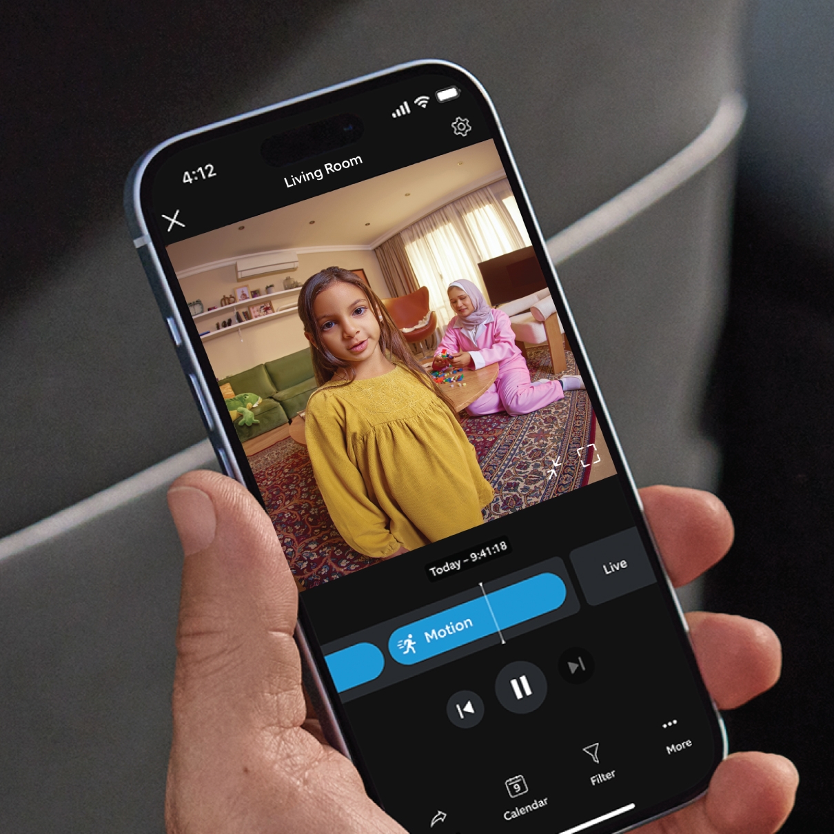 Cell phone screen shows a video recording in the Ring app. 